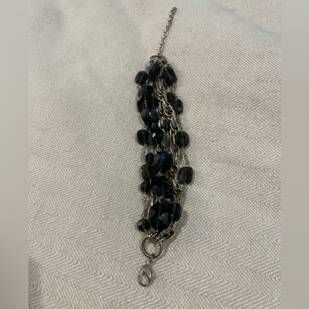 Green and gold chain and bead bracelet.